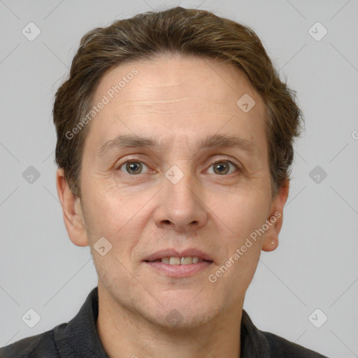 Joyful white adult male with short  brown hair and grey eyes