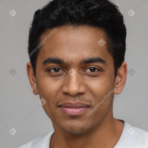 Joyful black young-adult male with short  black hair and brown eyes