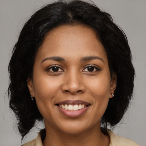 Joyful latino young-adult female with medium  black hair and brown eyes