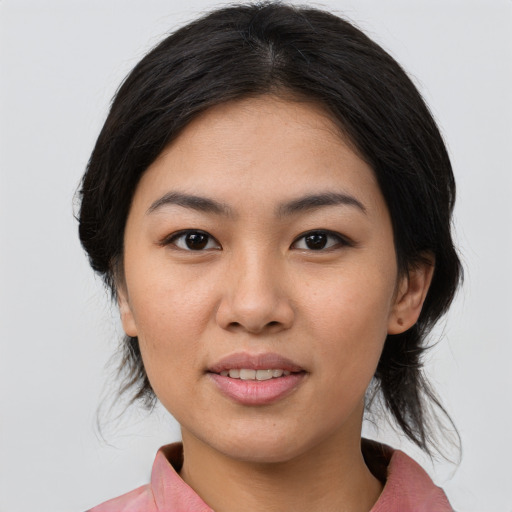 Joyful asian young-adult female with medium  black hair and brown eyes