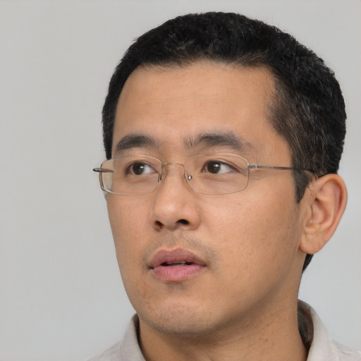 Neutral asian young-adult male with short  black hair and brown eyes