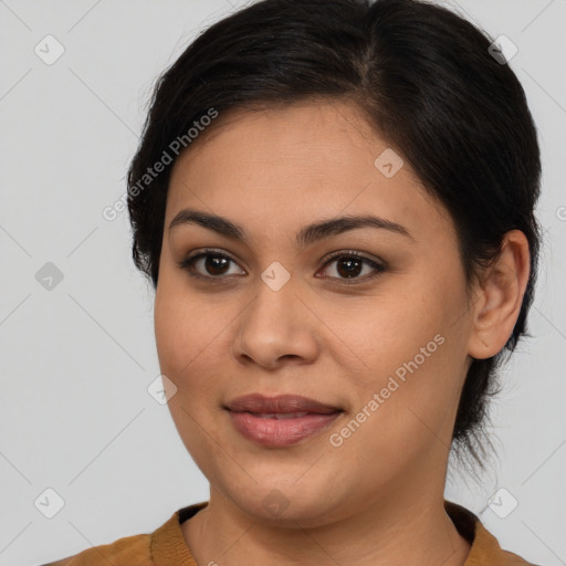 Joyful latino young-adult female with medium  brown hair and brown eyes