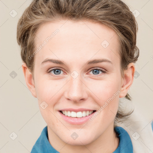 Joyful white young-adult female with short  brown hair and grey eyes