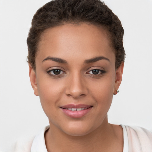 Joyful white young-adult female with short  brown hair and brown eyes