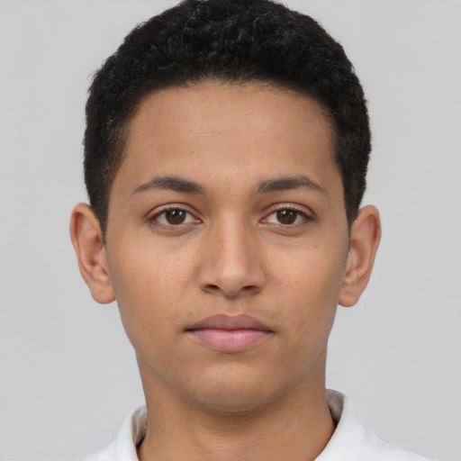 Neutral latino young-adult male with short  brown hair and brown eyes