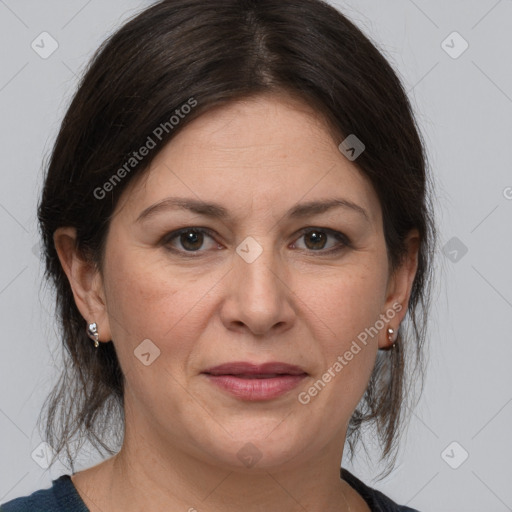 Joyful white adult female with medium  brown hair and grey eyes