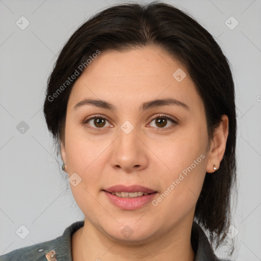 Joyful white adult female with medium  brown hair and brown eyes