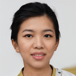 Joyful asian young-adult female with short  black hair and brown eyes