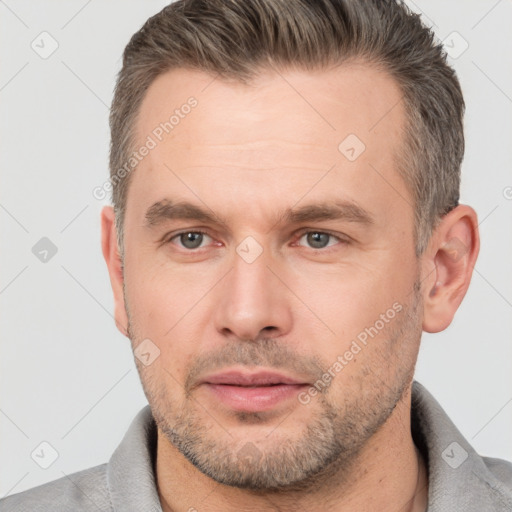 Neutral white adult male with short  brown hair and brown eyes