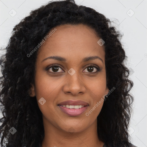 Joyful black young-adult female with long  brown hair and brown eyes