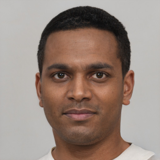 Neutral black young-adult male with short  black hair and brown eyes