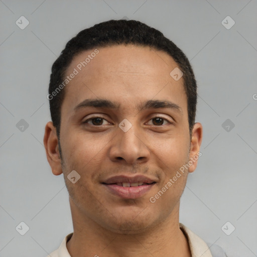 Joyful latino young-adult male with short  black hair and brown eyes