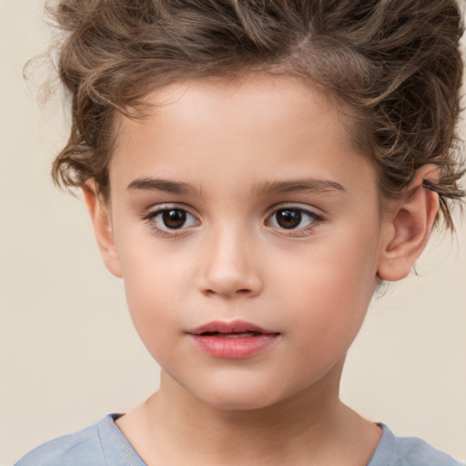 Joyful white child female with short  brown hair and brown eyes