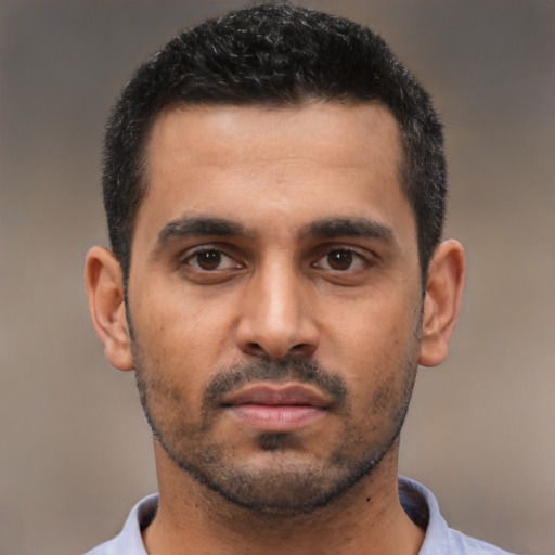 Neutral latino young-adult male with short  black hair and brown eyes