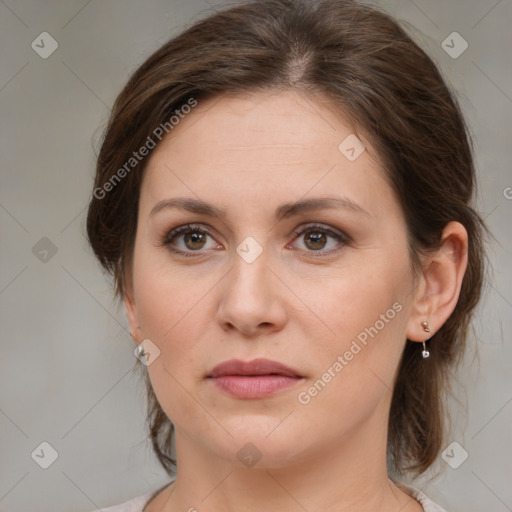 Joyful white young-adult female with medium  brown hair and green eyes