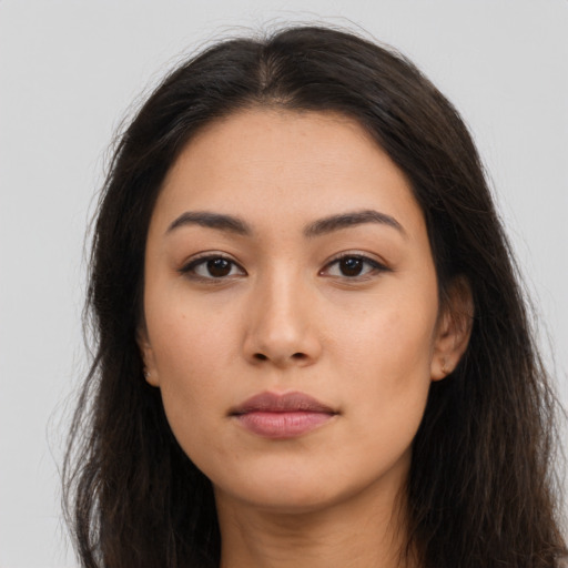 Neutral latino young-adult female with long  brown hair and brown eyes