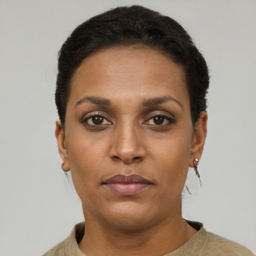 Neutral latino adult female with short  brown hair and brown eyes