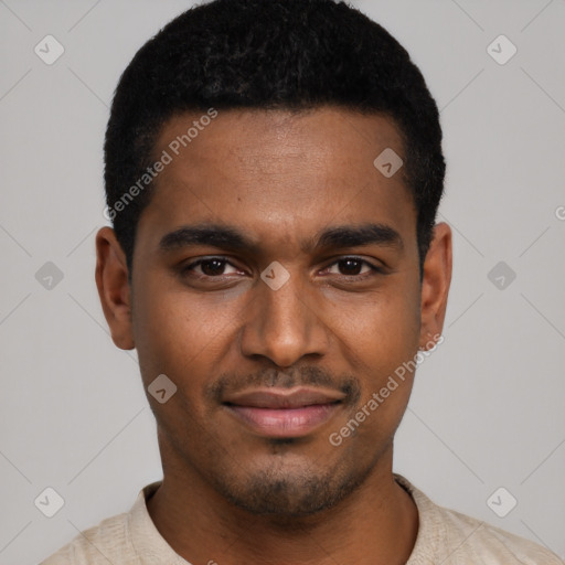 Joyful black young-adult male with short  black hair and brown eyes