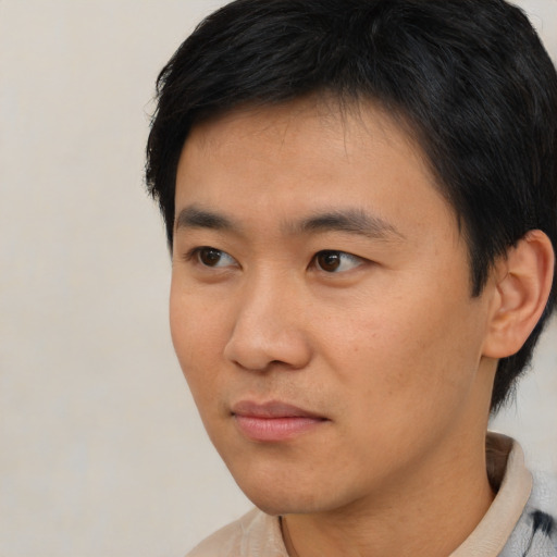 Neutral asian young-adult male with short  black hair and brown eyes