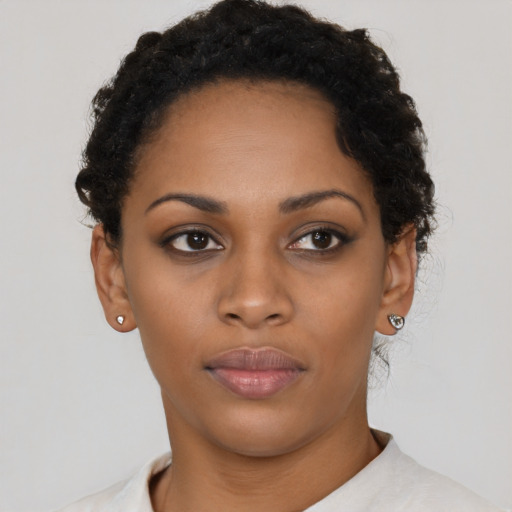 Neutral black young-adult female with short  black hair and brown eyes