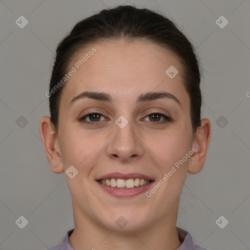 Joyful white young-adult female with short  brown hair and brown eyes