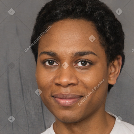 Joyful black young-adult female with short  black hair and brown eyes