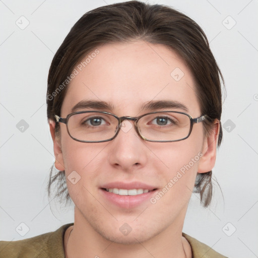 Joyful white young-adult female with short  brown hair and grey eyes