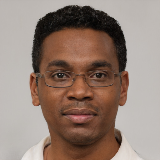 Neutral black adult male with short  black hair and brown eyes