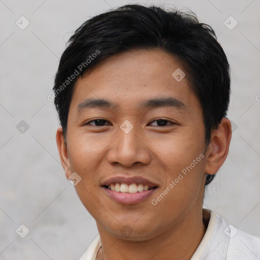 Joyful asian young-adult male with short  black hair and brown eyes