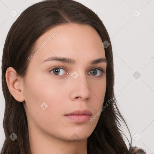 Neutral white young-adult female with long  brown hair and brown eyes