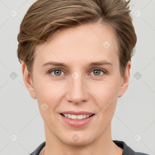 Joyful white young-adult female with short  brown hair and grey eyes