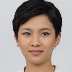 Joyful asian young-adult female with short  black hair and brown eyes