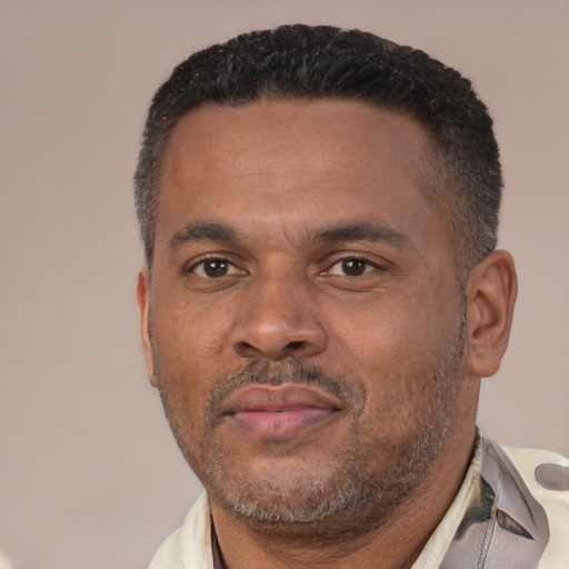 Neutral black adult male with short  black hair and brown eyes