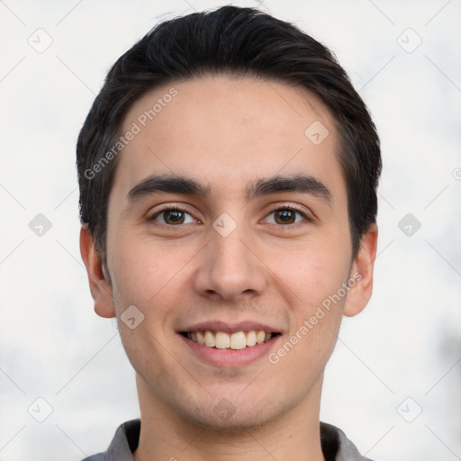 Joyful white young-adult male with short  black hair and brown eyes