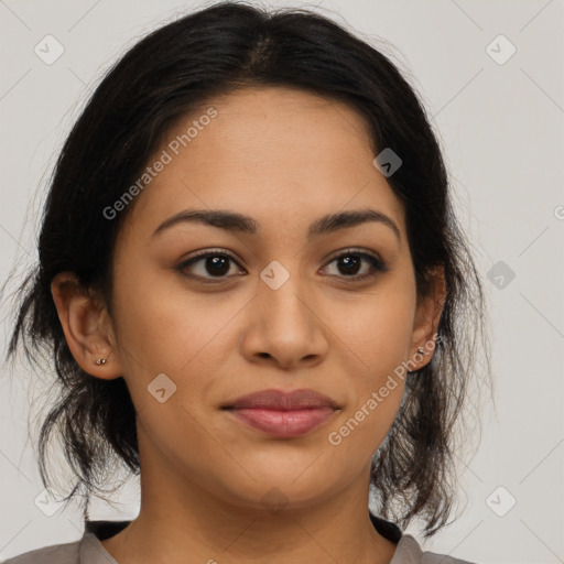 Joyful latino young-adult female with medium  brown hair and brown eyes