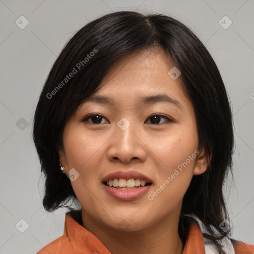 Joyful asian young-adult female with medium  black hair and brown eyes