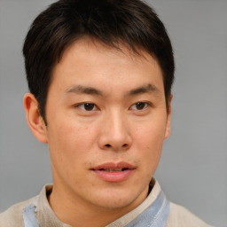 Neutral asian young-adult male with short  brown hair and brown eyes