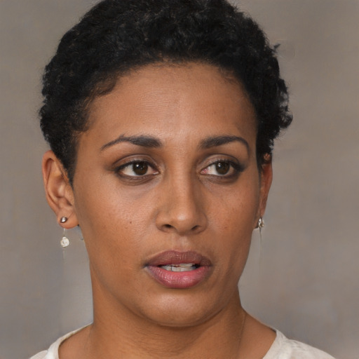 Neutral black young-adult female with short  brown hair and brown eyes
