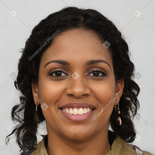 Joyful black young-adult female with long  brown hair and brown eyes