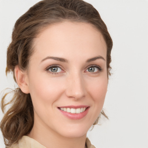 Joyful white young-adult female with medium  brown hair and green eyes