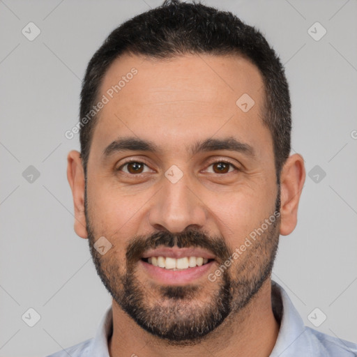 Joyful white young-adult male with short  black hair and brown eyes