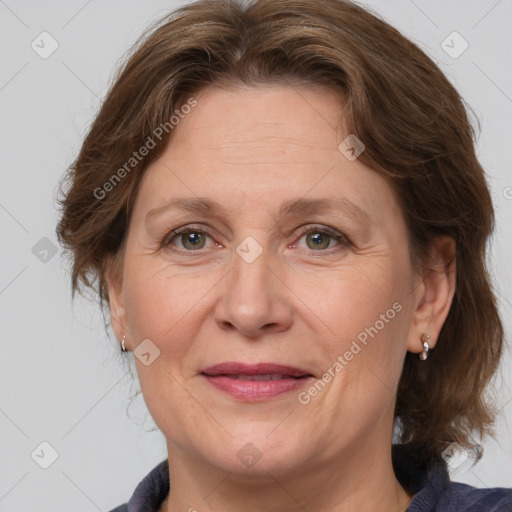 Joyful white adult female with medium  brown hair and grey eyes