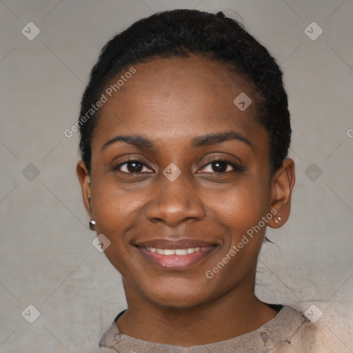 Joyful black young-adult female with short  black hair and brown eyes