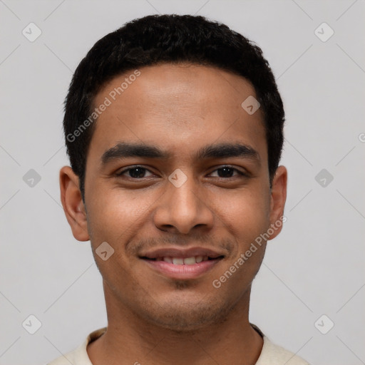 Joyful latino young-adult male with short  black hair and brown eyes