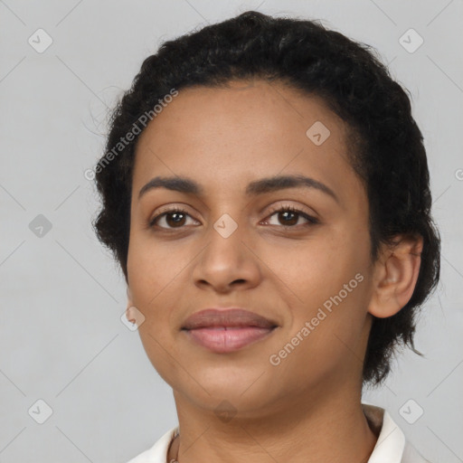 Joyful latino young-adult female with short  black hair and brown eyes