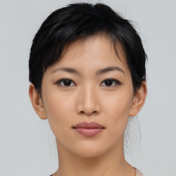 Neutral asian young-adult female with medium  brown hair and brown eyes