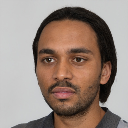 Neutral black young-adult male with short  black hair and brown eyes
