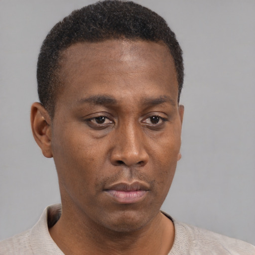 Neutral black young-adult male with short  brown hair and brown eyes