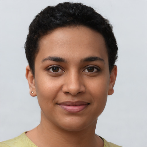 Joyful latino young-adult female with short  brown hair and brown eyes