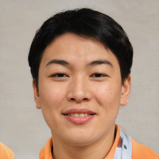 Joyful asian young-adult female with short  brown hair and brown eyes